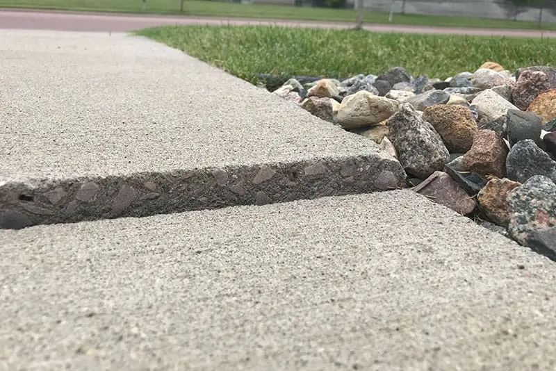 sidewalk repair needed lifted concrete