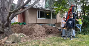 R&R Foundation Specialist team member working in the yard of a home.